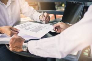 businessman and lawyer fixing contract