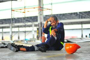 xconstruction worker with injured head and leg