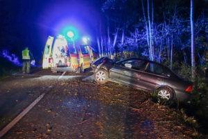 ambulance on scene of car accident at night