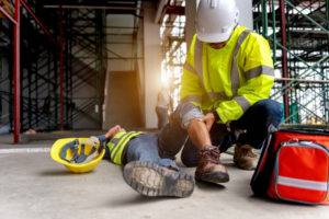 an injured construction worker being attended to after an accident