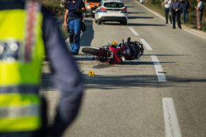 red sport motorcycle crash scene