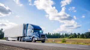 A blue semi-truck on the road moments before an accident. An Albany semi-truck accident lawyer can help you seek compensation.