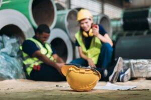 Two men after a construction accident. Learn how lawyers can determine fault in a construction accident.